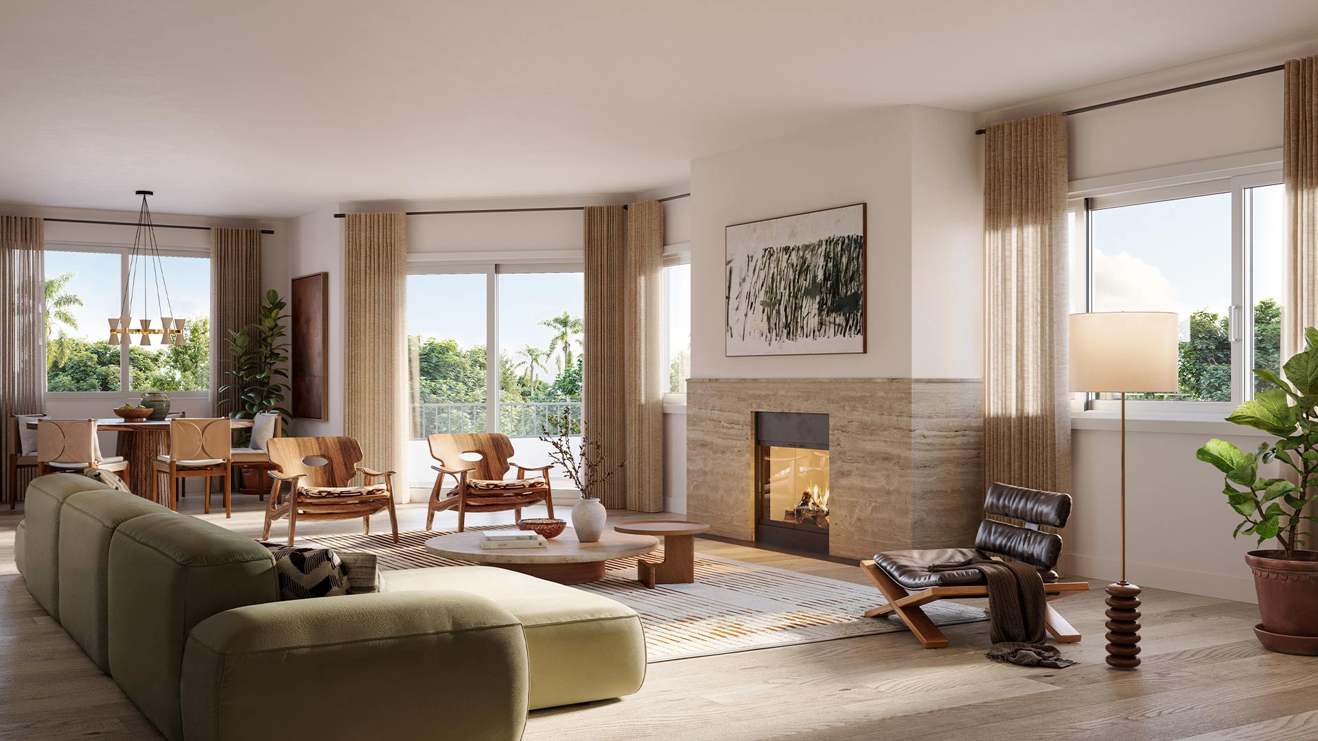 Elegant living room with green sectional, leather chair, stone fireplace, large windows, and modern furnishings.